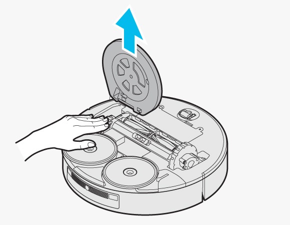 Hand pressing down on the Driving Wheels to remove the Spin Brush Cover from the Samsung Jet Bot Combo.