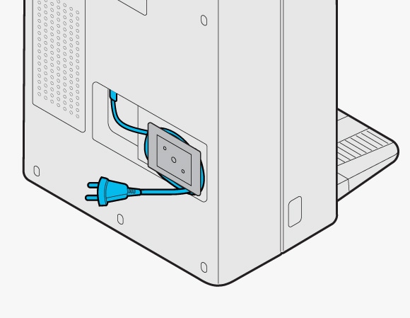 Inserting the power cord into the groove at the rear of the Clean Station to secure it in place.