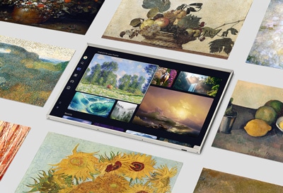 Samsung The Frame TV displaying various digital artworks, showcasing its Art Mode feature surrounded by physical paintings.