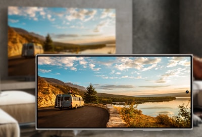 Samsung Smart TV displaying a scenic view, showcasing the screen mirroring feature with a Galaxy phone.