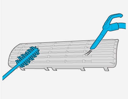 A brush and a small vacuum are used to clean the filter of a Samsung Air conditioner