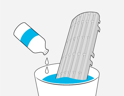 The filter of a Samsung Air conditioner is being washed using a mild detergent