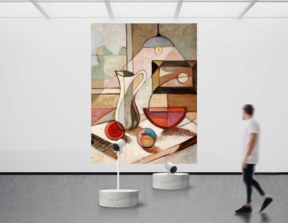 Two The Freestyle projectors are displaying a art piece on a wall