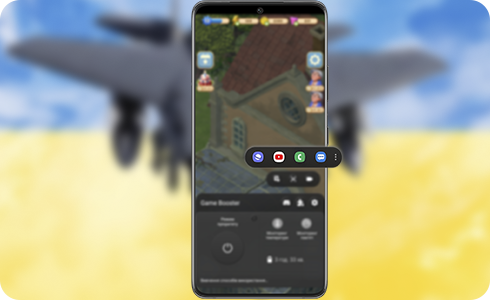 Смартфон із підсвічуваною спливаючою панеллю під час гри.