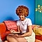 A women sitting on a couch using a Galaxy Tablet with a S Pen in a room