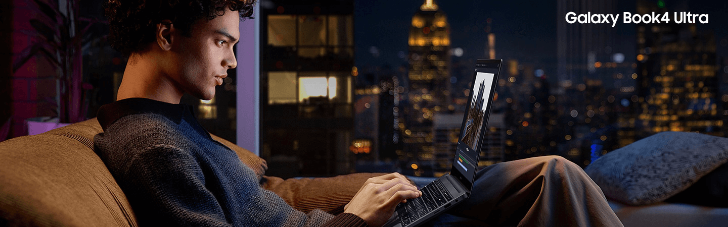 A male rests a laptop on his lap in a living room setting. To the right are images of the Book4 open and shut