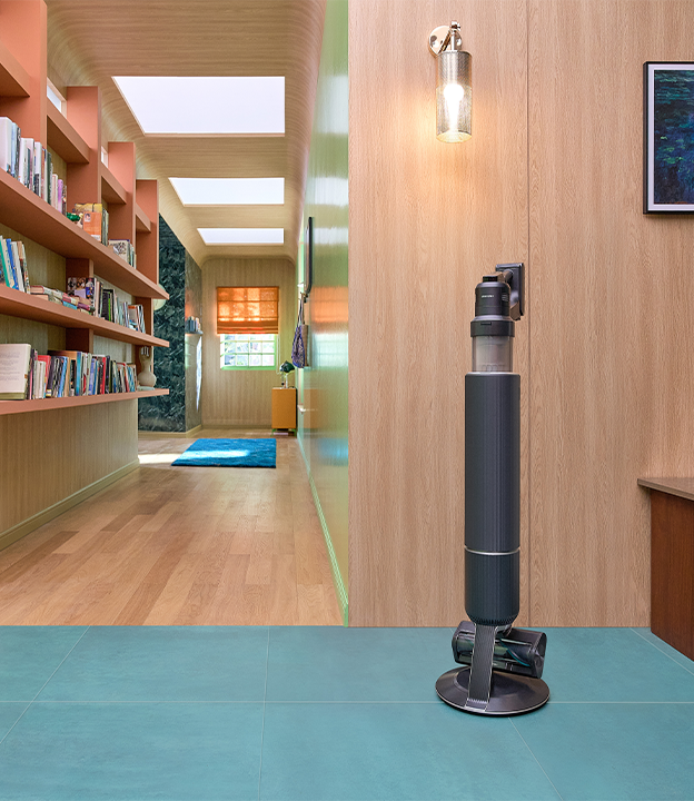 Two Bespoke Jet AI vacuums are in a room. The black Bespoke Jet AI vacuum is on the right next to a plant and the misty white Bespoke Jet AI vacuum is on the right. Two Bespoke Jet AI vacuums are in a room. The black Bespoke Jet AI vacuum is on the right next to a plant and the misty white Bespoke Jet AI vacuum is on the right.