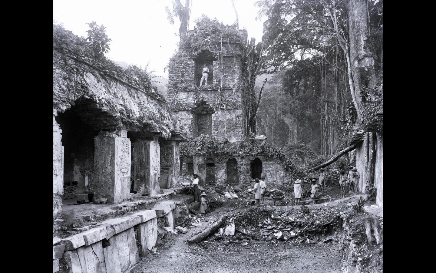 Old black and white photograph of ruined buildings in a rainforest Old black and white photograph of ruined buildings in a rainforest