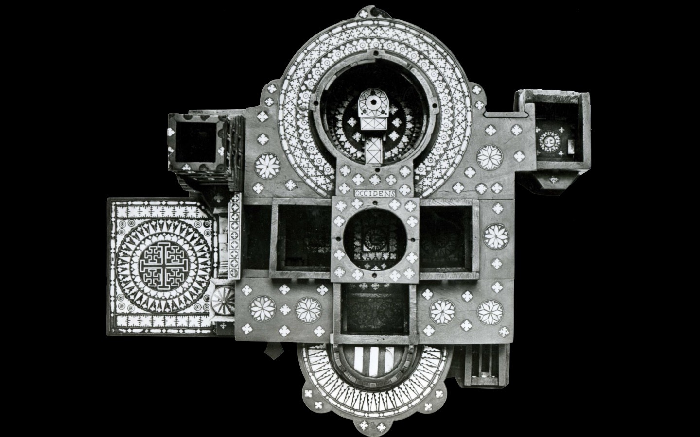 Black and white photo from above of a model church decorated with geometric patterns Black and white photo from above of a model church decorated with geometric patterns