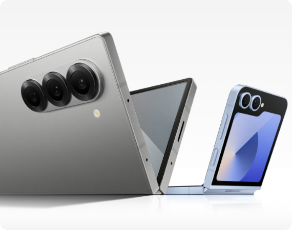 A silver shadow Galaxy Z Fold6 is laying half open next to a blue half unfolded Galaxy Z Flip6.