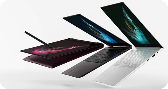 Three laptops in a range of angles are shown with their screens displaying a colourful graphic.