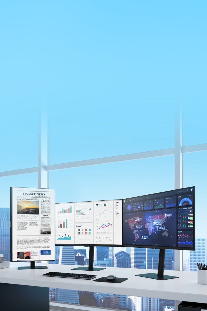 Three Samsung Monitors are shown on a desk overlooking a city landscape