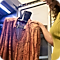 Orange shirt being placed in the AirDresser