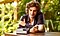 A man sits at a desk with a coffee cup in his hand and against a plant background. He is looking at a Galaxy Z Fold5 that’s propped up in front of him.