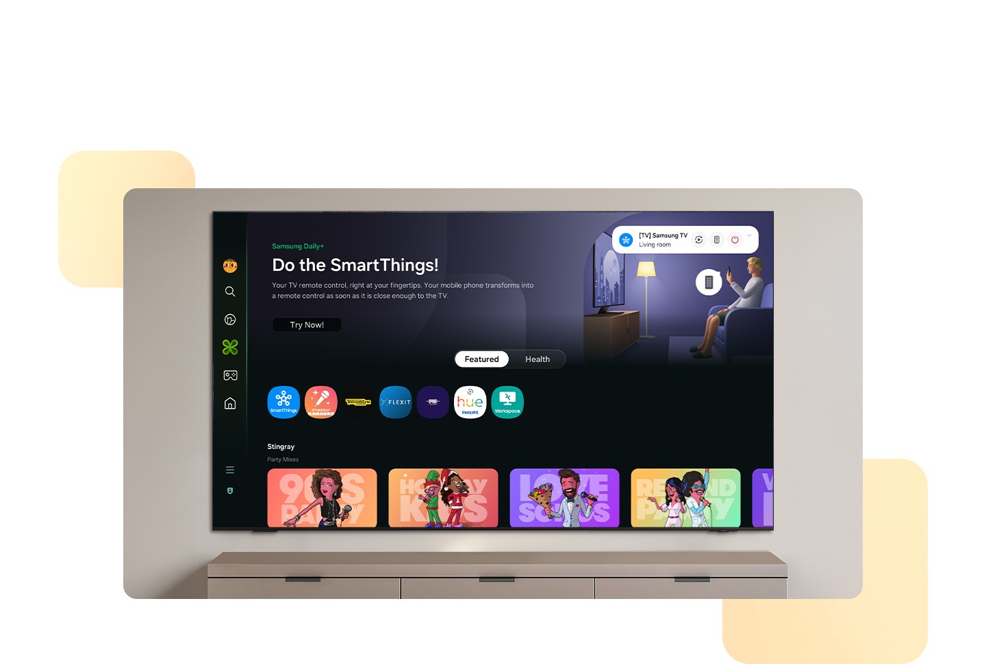 Samsung Daily+ home screen is displayed on a wall-mounted Samsung Smart TV. Scroll down to view key features such as SmartThings and the status of various smart home devices including the most used ones, the Living room Air conditioner set at 24°C, the Living room Light which is on, and Movie. Back at the top, the bar is toggled from Featured to Health. The screen then displays various health-related content. The Workout Tracker feature paired with a Galaxy Watch 6 is highlighted.