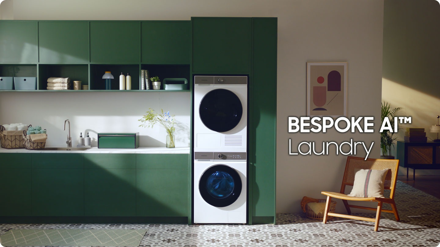 A woman sits on the floor and plays with her cat in front of a white Bespoke AI™ washer and dryer set. The laundry is spinning inside the washer on the left. Stylish. A man is sitting on a countertop reading a magazine and drinking a cup of coffee. Below the counter is a black Bespoke AI™ washer and dryer set. Energy saving. Then it switches to a close up of fabric covered in detergent bubbles. AI Ecobubble™. Inside of a washer is shown. A wave of water rushes forward. Wash cool. A white Bespoke AI™ washer and dryer set is stacked on top of one another in a blue kitchen. 11kg Large capacity. A woman is sitting in a bright entryway. She is spraying a plant with water near a white Bespoke AI™ washer and dryer with Morning Blue panels stacked on top of each other, built into a blue cabinet. Less Energy. A man is walking through a doorway into a room while pushing a bike. In the back of the room is a black Bespoke washer and dryer set placed under a counter. More Capacity. The first woman with her cat appear. She is leaning on the cabinet and a cat is sitting in front of the dryer. BESPOKE AI Laundry.