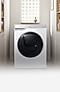 A white Samsung washer dryer stood in a utility closet.