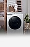 A white Samsung washing machine stood in a utility closet.