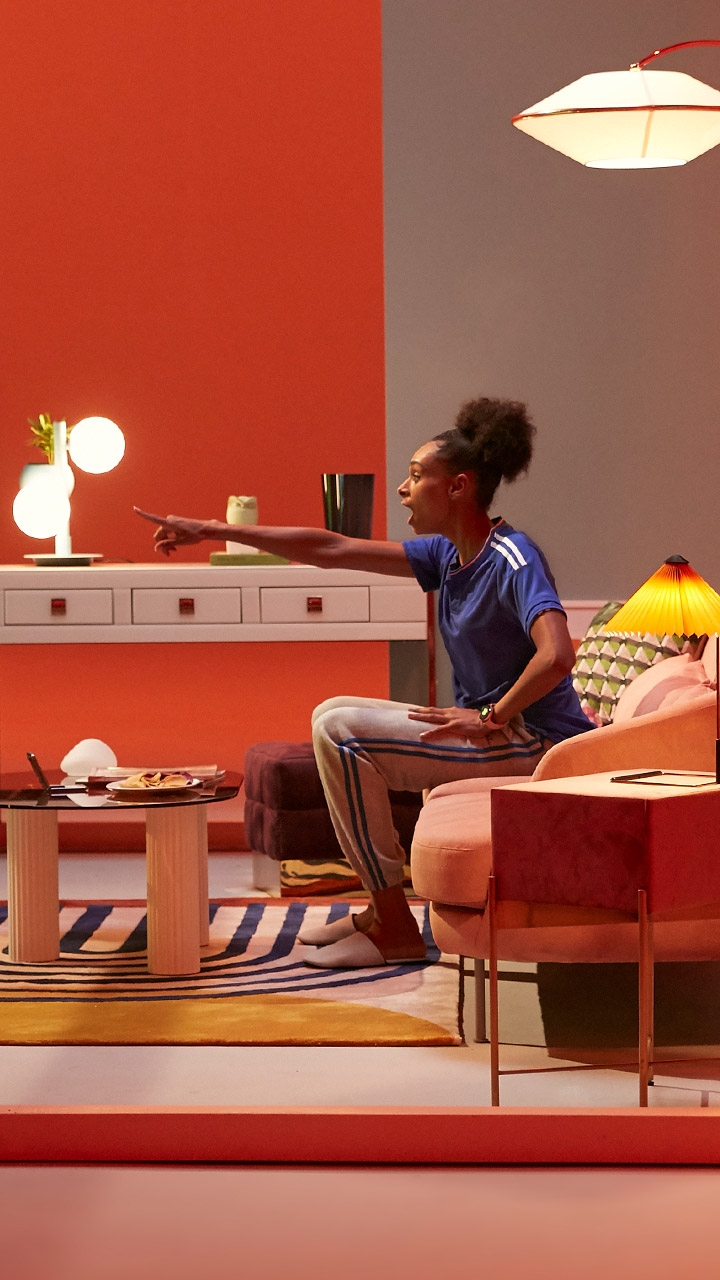Woman watching soccer match on TV