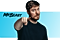 MrBeast looks into camera and points with a smile.