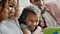 A family gathers around a Samsung device
