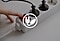 A hand turning off the switch of a power strip, overlaid with an icon indicating eco-friendly charging.