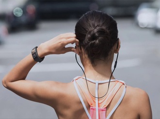 Woman getting ready for workout using her Samsung Galaxy Gear Fit2