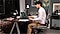 A young man works from his home office using his Galaxy Book3 Pro 360