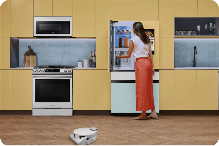 A woman in her fully decked out Smart Samsung AI-enabled kitchen