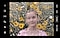 The screen of a Galaxy S21 Ultra 5G showing a portrait of a girl in front of yellow flowers taken through droplets of water. The water droplets are highlighted by a circular symbol, indicating they should be in focus.