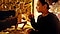 A still from Joe Wright's film, Princess & Peppernose. A young woman with a look of wonder on her face reaches out towards a puppet of a man.