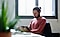 A man sitting at a desk works on his Galaxy Tab.