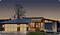 A modern home at dusk, lit up beautifully.