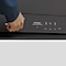 Close up of a hand interacting with AI smart Dial panel on a Samsung Bespoke AI Laundry Hub™ in Brushed Black