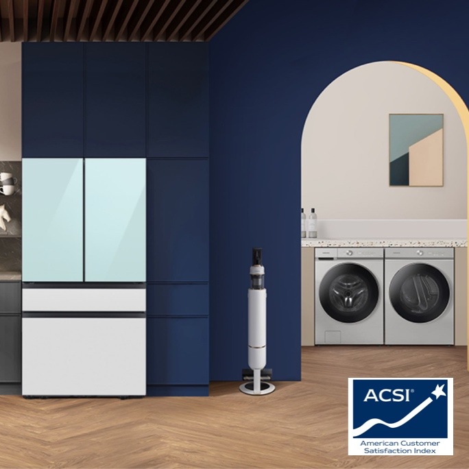 Bespoke home appliances in a dark blue and white kitchen and laundry area with ACSI badge