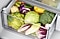 Assorted vegetables in a Samsung Refrigerator crisper drawer