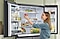 Woman placing an apple inside a Bespoke Refrigerator with doors open