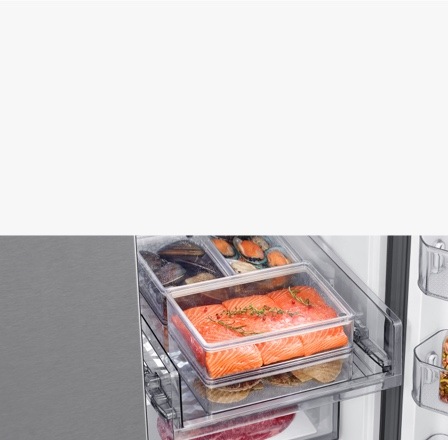 Close up of FlexZone™ inside a Samsung Refrigerator with a variety of seafood and meat items in the clear drawers