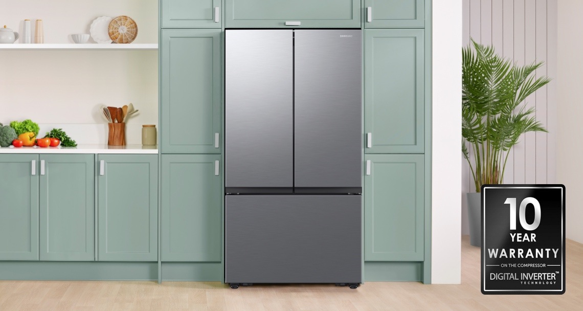 Samsung Bespoke 3-Door French Door Refrigerator in Stainless Steel in a kitchen with light blue cabinets
