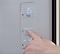 Person using custom refrigerator temperature control settings