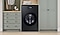 Black Bespoke Washer Dryer Combo in a Laundry Room