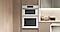 White Glass Microwave Combination Wall Oven among light wood cabinets