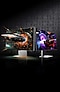 An ultrawide curved gaming monitor with game screen and a back design of gaming monitor