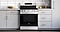Freestanding Stainless Steel Oven Range Among White Cabinets
