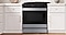 Convection Oven with Gas Stovetop Among White Cabinets
