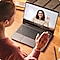 Two women having a video conference with each other over a laptop.