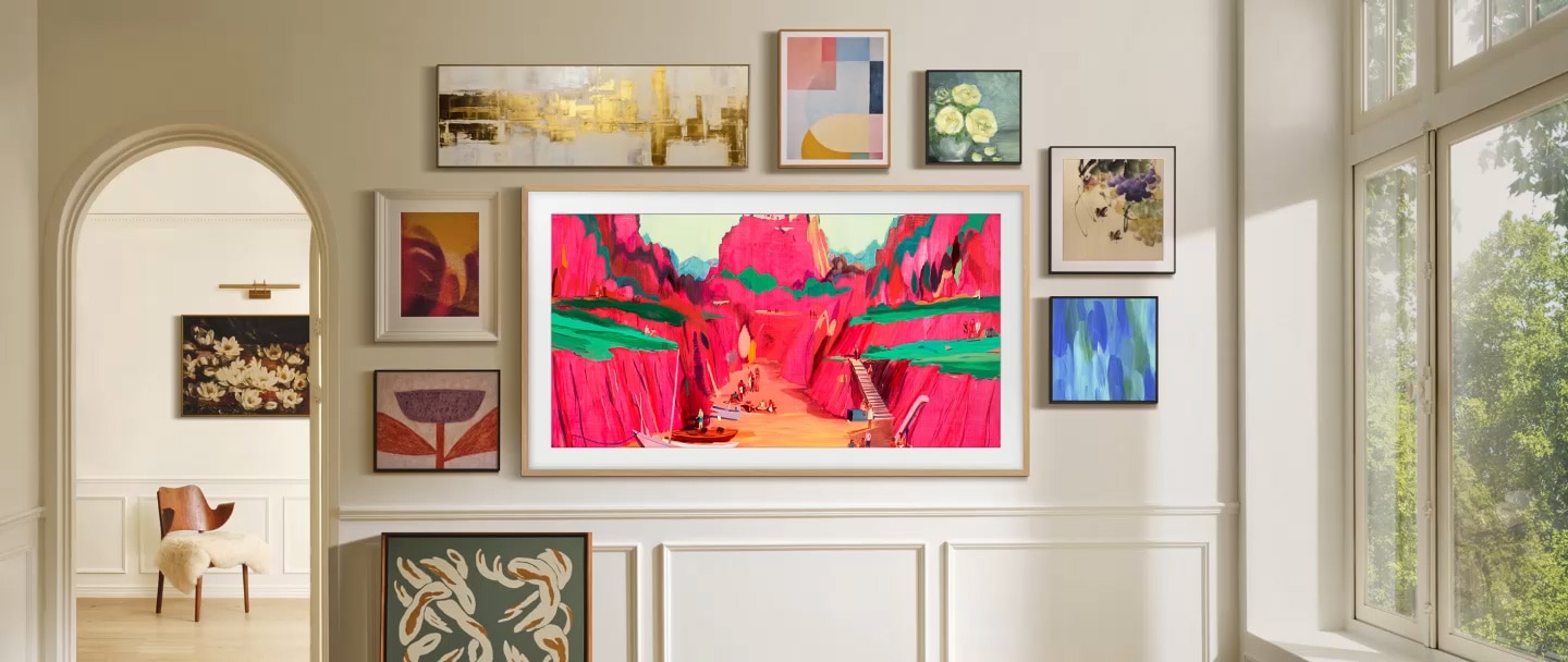 The Frame Pro TV is installed on the wall of a living space. It blends in with the surrounding wall art.