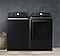 Top load washing machine and dryer in laundry room