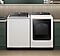 Top load washing machine and dryer in laundry room