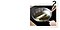 Step 2. A person is cooking a fish on the Infinite Range CombiHob, which features a ventilation function designed to capture odors and vapors during cooking. They are using a sauté pan filled with olive oil and is flipping the fish with a spatula.